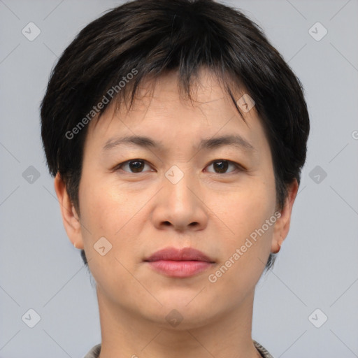 Joyful asian young-adult female with short  brown hair and brown eyes