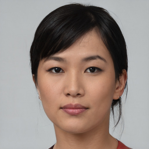 Neutral asian young-adult female with medium  black hair and brown eyes