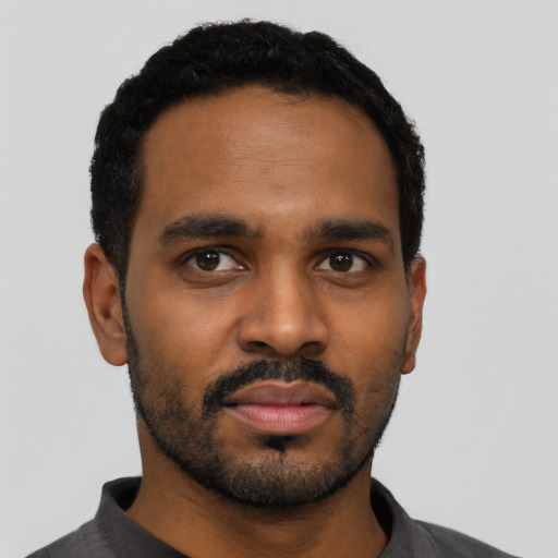 Neutral black young-adult male with short  black hair and brown eyes