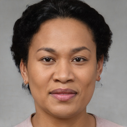 Joyful asian adult female with short  brown hair and brown eyes