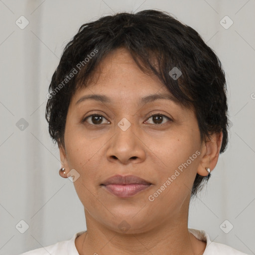 Joyful latino adult female with short  brown hair and brown eyes