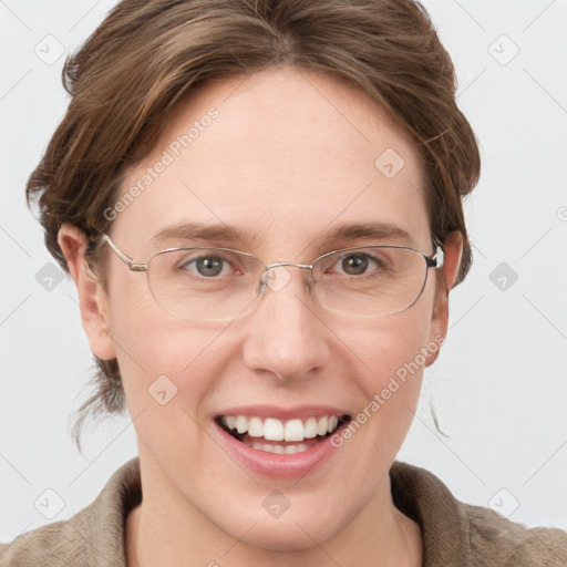 Joyful white adult female with short  brown hair and grey eyes