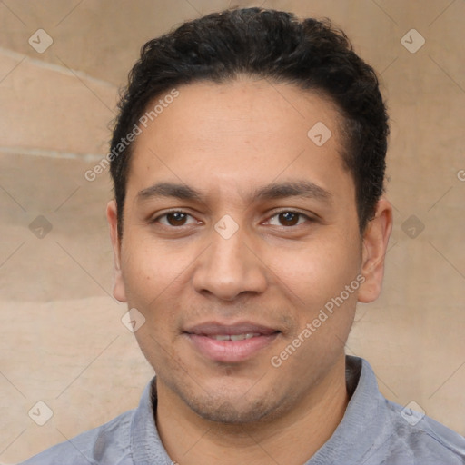 Joyful white young-adult male with short  black hair and brown eyes