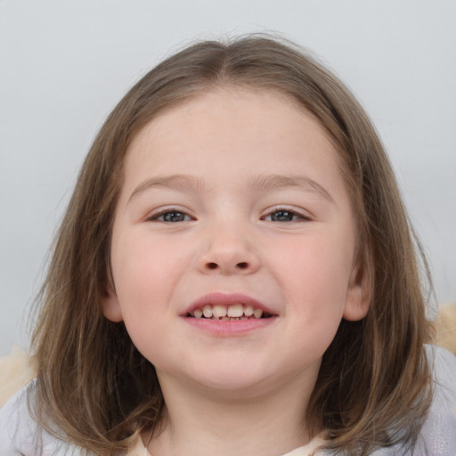 Joyful white child female with medium  brown hair and grey eyes