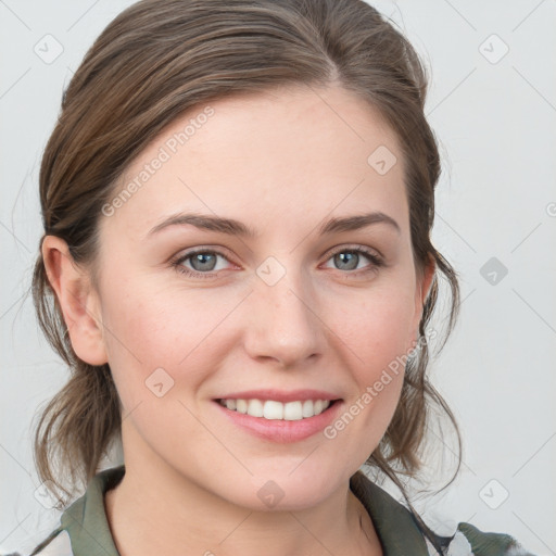 Joyful white young-adult female with medium  brown hair and blue eyes