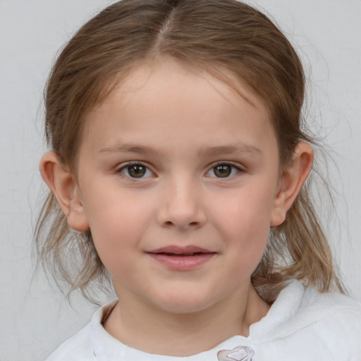 Joyful white child female with medium  brown hair and grey eyes