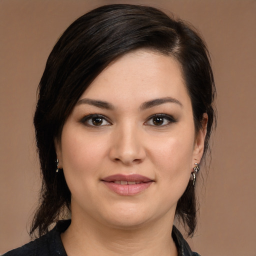 Joyful white young-adult female with medium  black hair and brown eyes