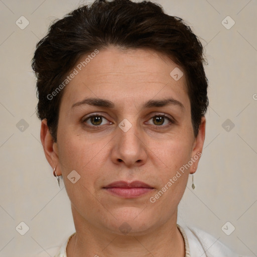 Joyful white adult female with short  brown hair and brown eyes