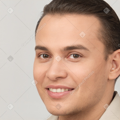 Joyful white young-adult male with short  brown hair and brown eyes