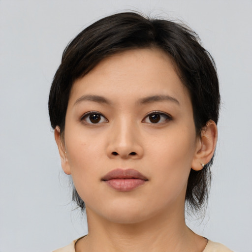 Neutral asian young-adult female with medium  brown hair and brown eyes