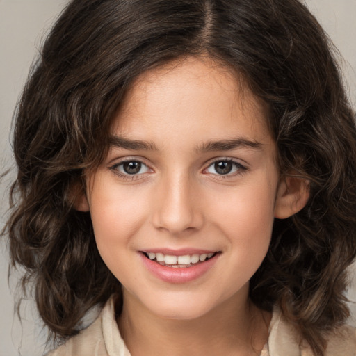 Joyful white child female with medium  brown hair and brown eyes