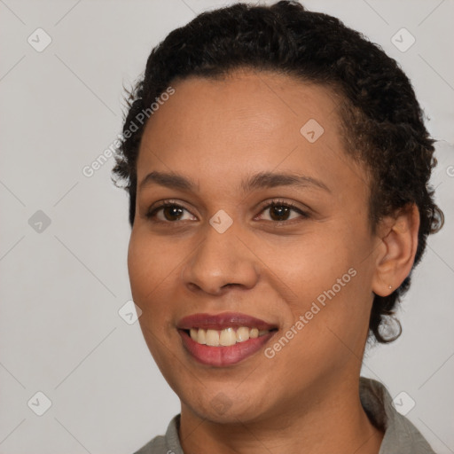 Joyful latino young-adult female with short  brown hair and brown eyes