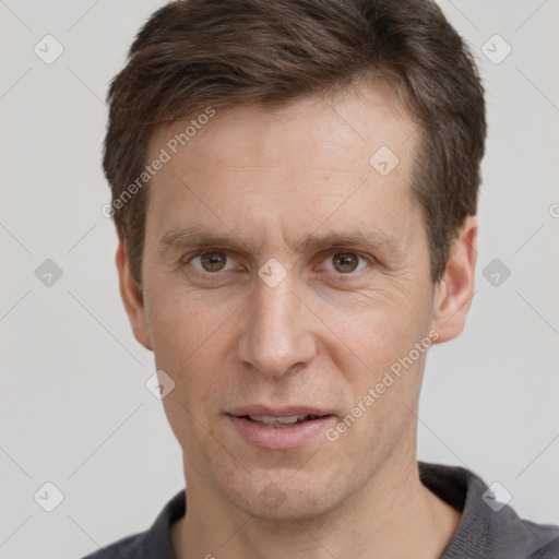 Joyful white adult male with short  brown hair and grey eyes