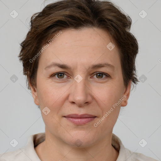 Joyful white adult female with short  brown hair and grey eyes