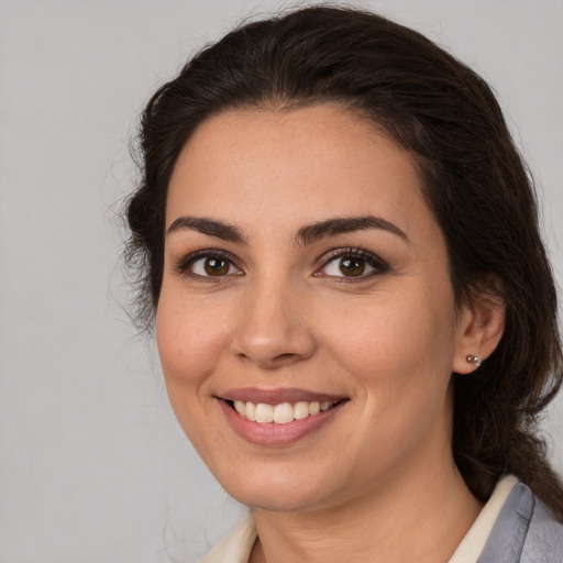 Joyful white young-adult female with medium  brown hair and brown eyes