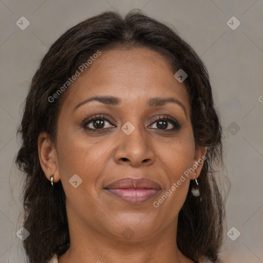 Joyful black adult female with medium  brown hair and brown eyes