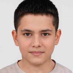 Joyful white child male with short  brown hair and brown eyes