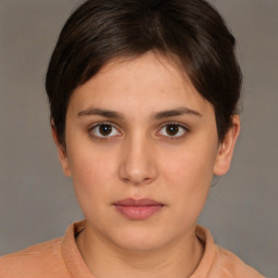 Neutral white young-adult female with short  brown hair and brown eyes