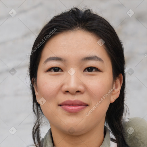 Joyful asian young-adult female with medium  brown hair and brown eyes