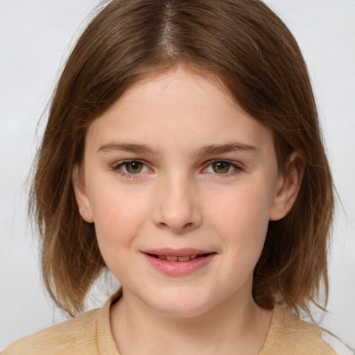 Joyful white child female with medium  brown hair and brown eyes