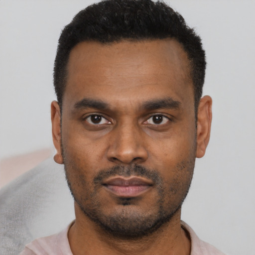 Neutral black young-adult male with short  black hair and brown eyes