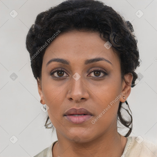 Joyful latino young-adult female with short  brown hair and brown eyes