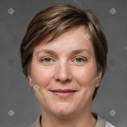 Joyful white adult female with short  brown hair and grey eyes