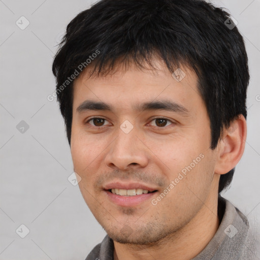 Joyful white young-adult male with short  black hair and brown eyes