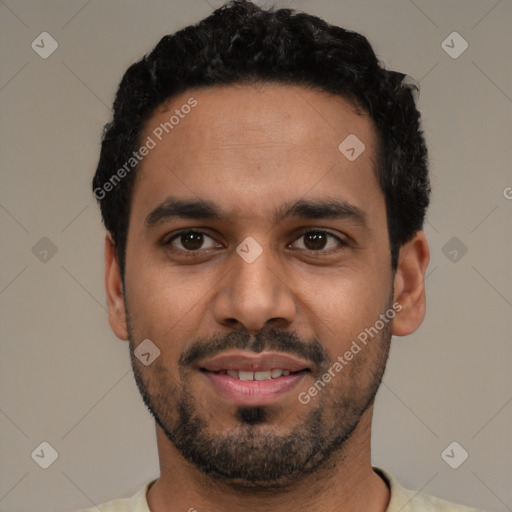 Joyful latino young-adult male with short  black hair and brown eyes