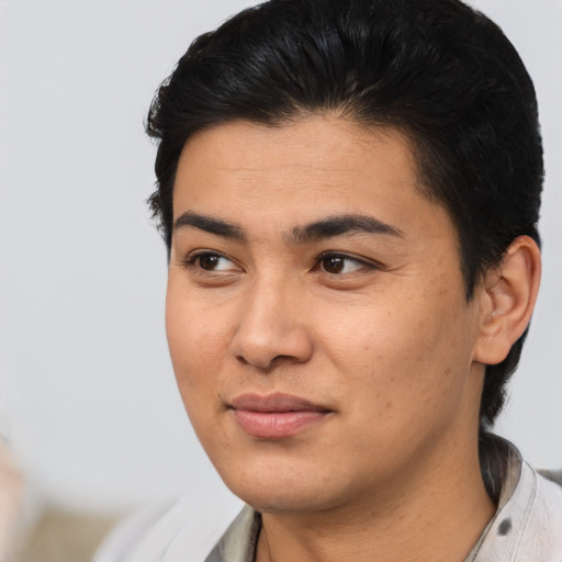 Joyful asian young-adult male with medium  black hair and brown eyes