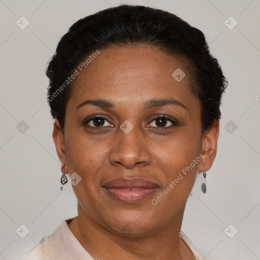 Joyful black adult female with short  brown hair and brown eyes