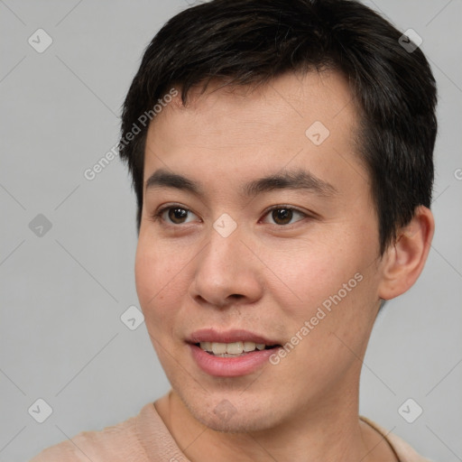 Joyful asian young-adult male with short  brown hair and brown eyes