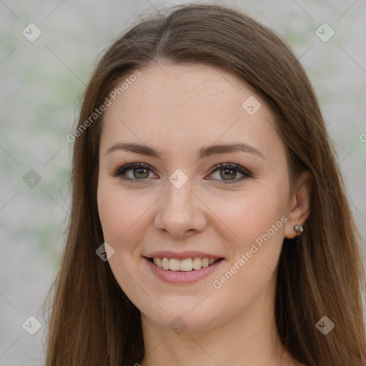 Joyful white young-adult female with long  brown hair and green eyes