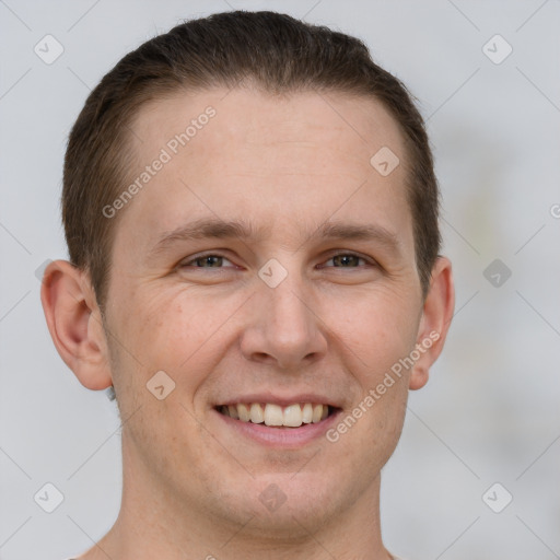 Joyful white young-adult male with short  brown hair and brown eyes