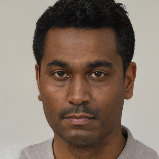 Neutral black young-adult male with short  black hair and brown eyes