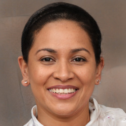 Joyful white adult female with short  brown hair and brown eyes