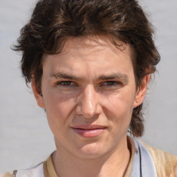 Joyful white adult male with medium  brown hair and brown eyes