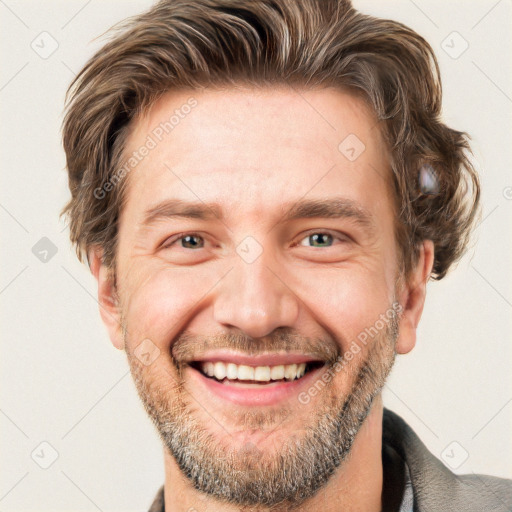 Joyful white adult male with short  brown hair and grey eyes