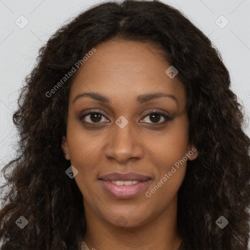 Joyful black young-adult female with long  brown hair and brown eyes