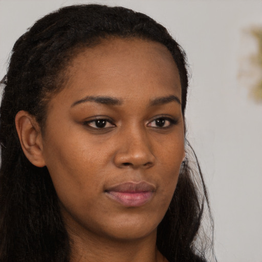 Neutral black young-adult female with long  brown hair and brown eyes
