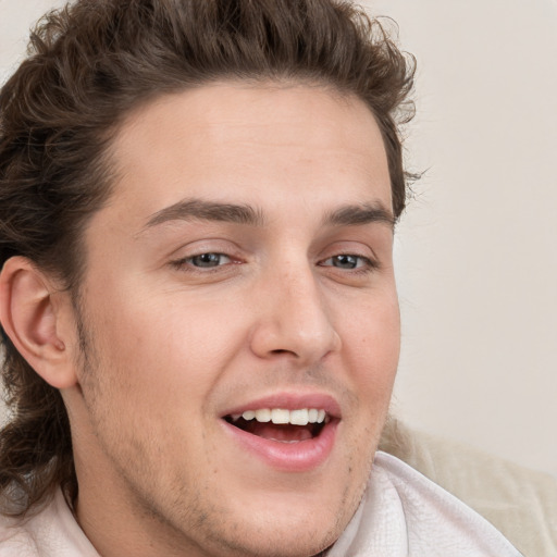 Joyful white young-adult male with medium  brown hair and brown eyes