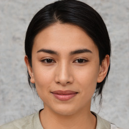 Joyful asian young-adult female with medium  brown hair and brown eyes