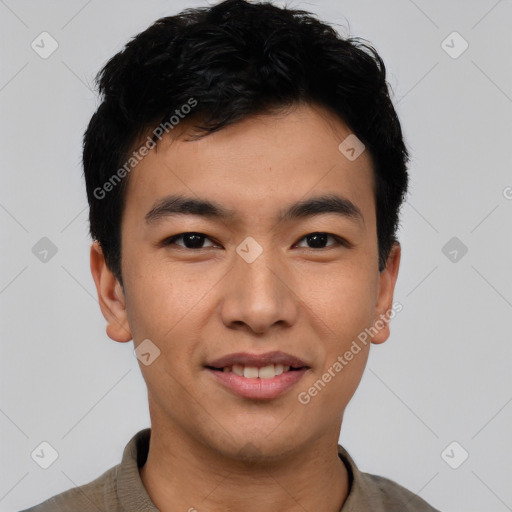 Joyful asian young-adult male with short  black hair and brown eyes