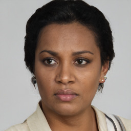 Neutral latino young-adult female with short  black hair and brown eyes