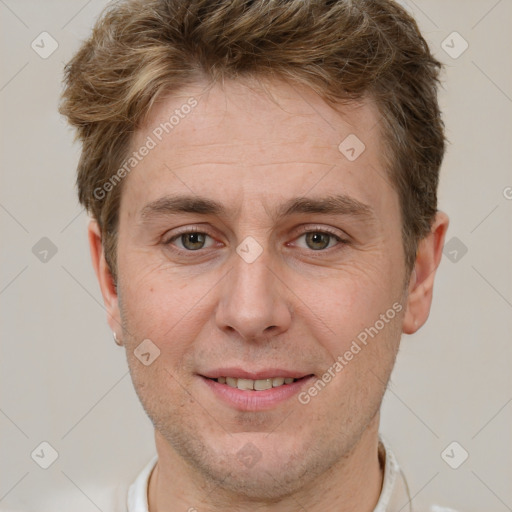 Joyful white adult male with short  brown hair and grey eyes