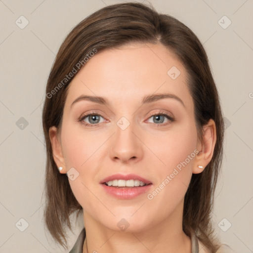 Joyful white young-adult female with medium  brown hair and grey eyes