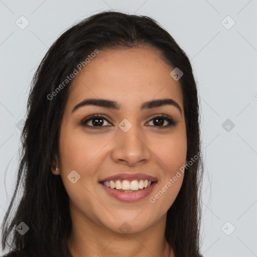 Joyful latino young-adult female with long  brown hair and brown eyes