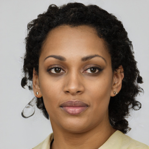 Neutral black young-adult female with short  black hair and brown eyes