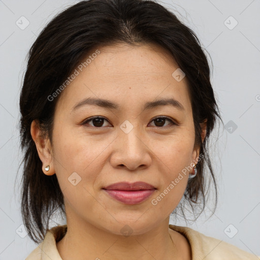 Joyful asian adult female with medium  brown hair and brown eyes