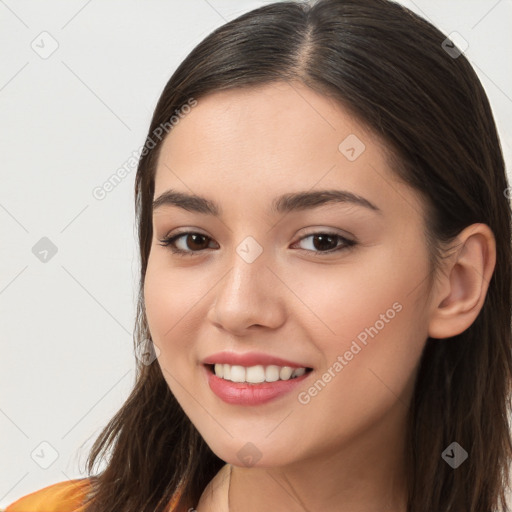 Joyful white young-adult female with long  brown hair and brown eyes